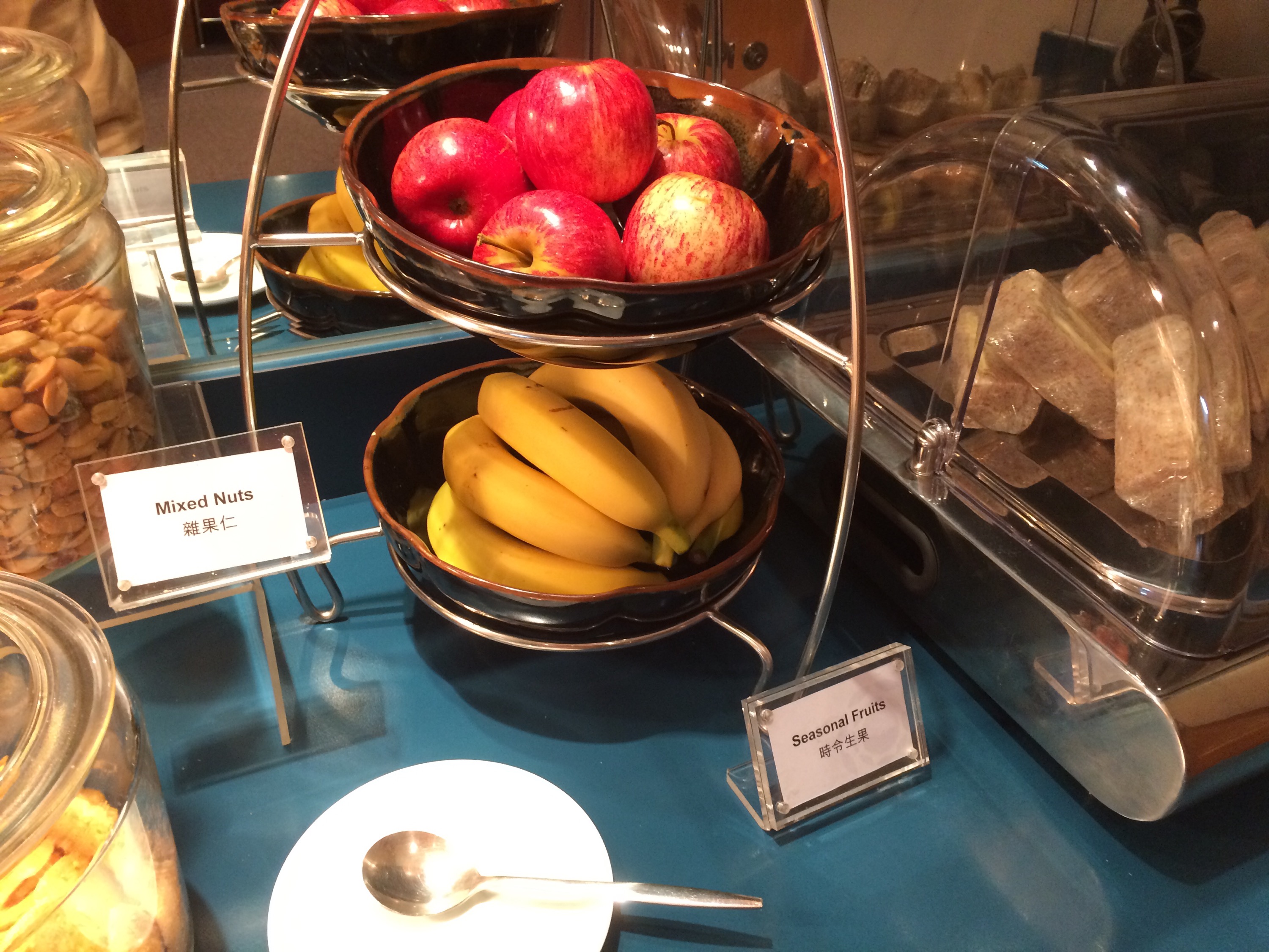 a bowl of fruit on a shelf