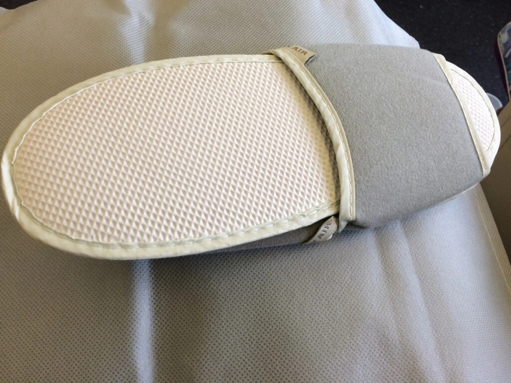 a slipper on a bed