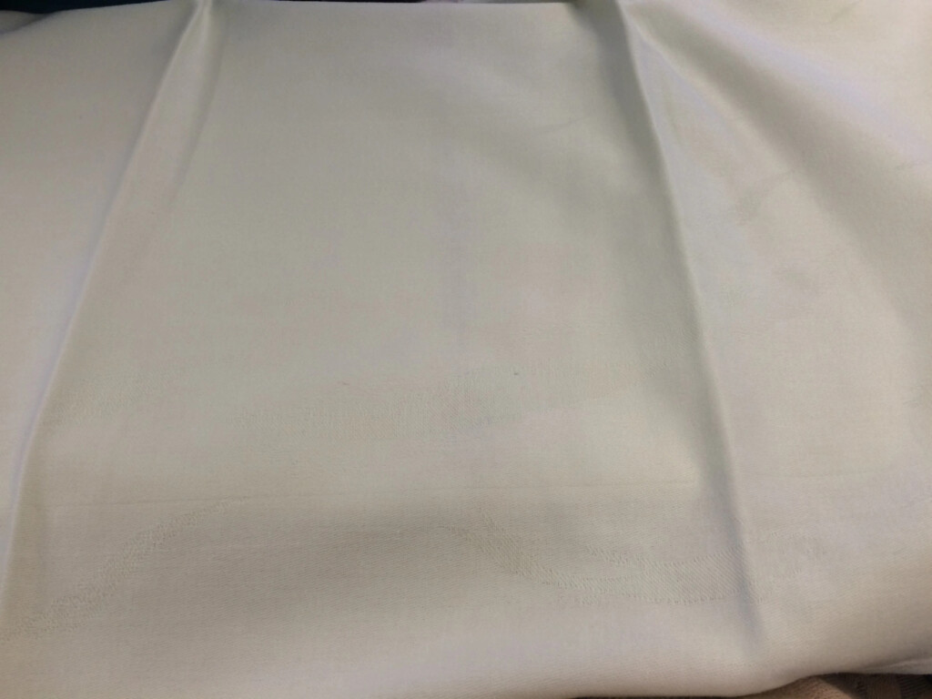 a white cloth folded on a table