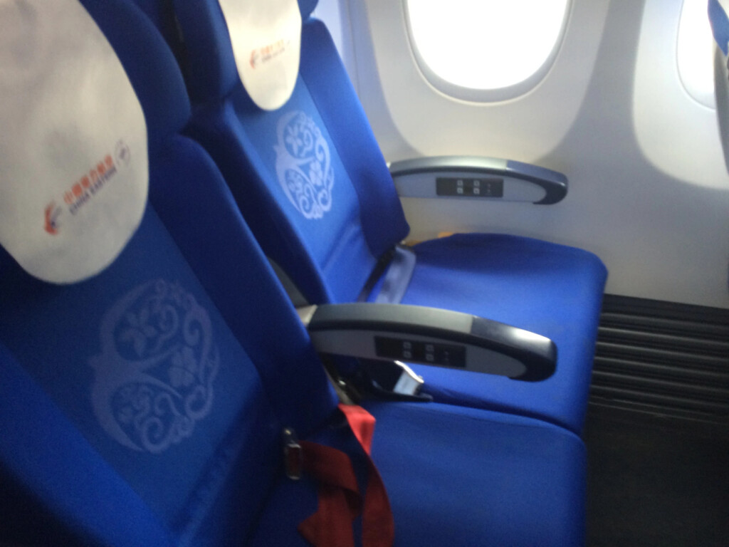 a blue seats in an airplane