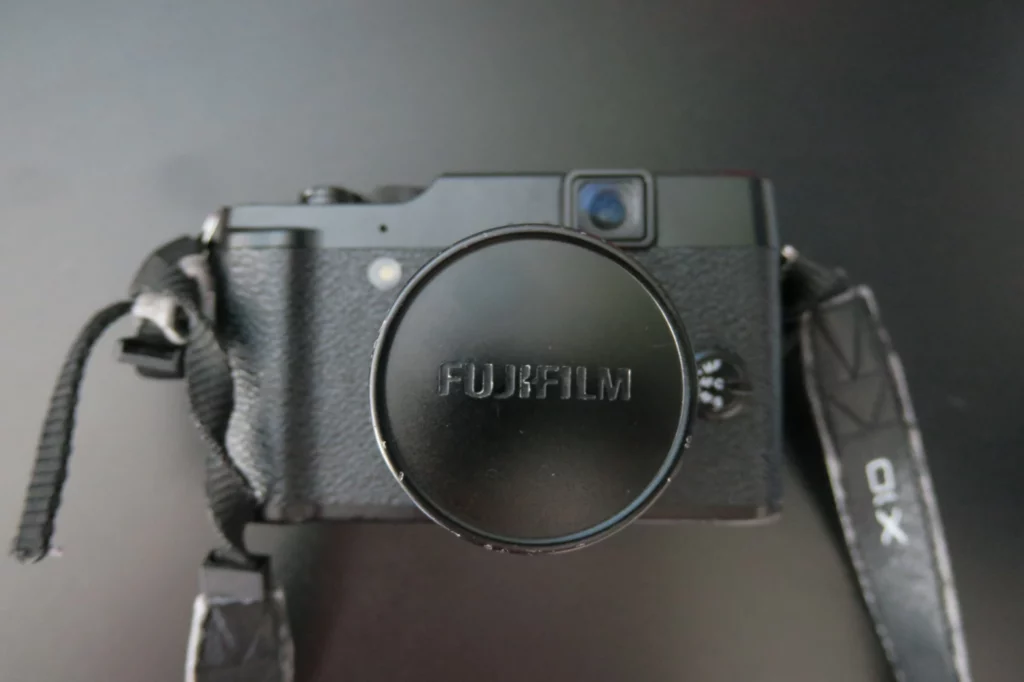 a black camera with a black strap
