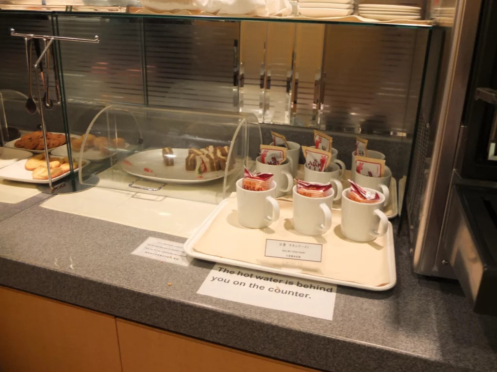 a display case with cups and plates on it