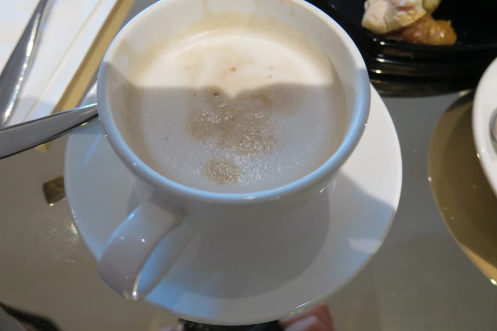 a cup of coffee with foam