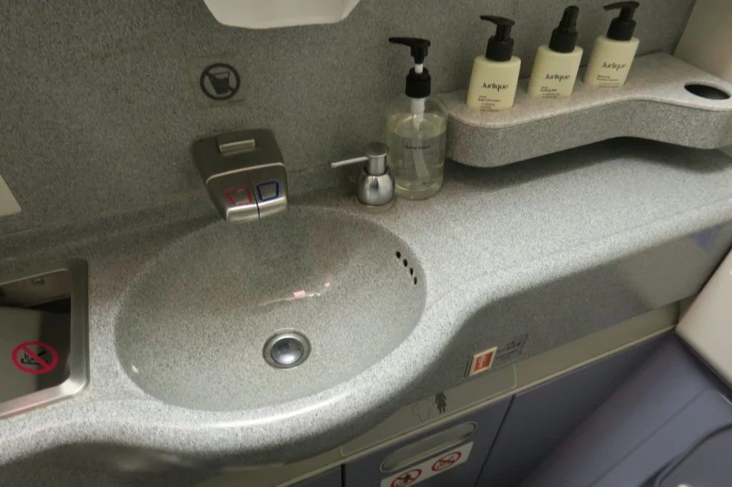 a sink with soap bottles on it