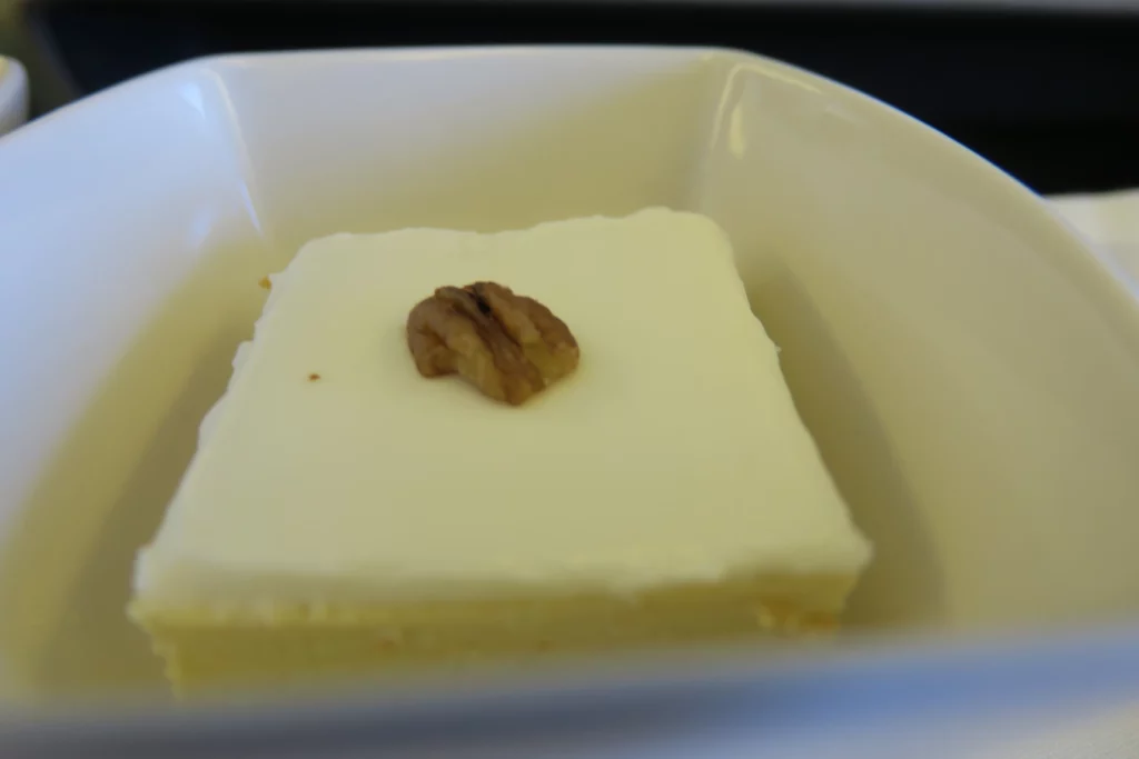 a piece of cake with a pecan topping