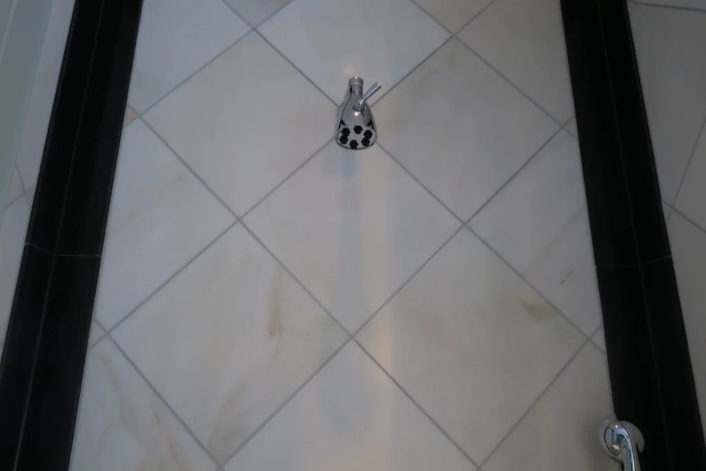 a faucet on a tile floor