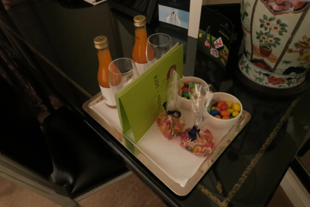 a tray with candy and drinks on it