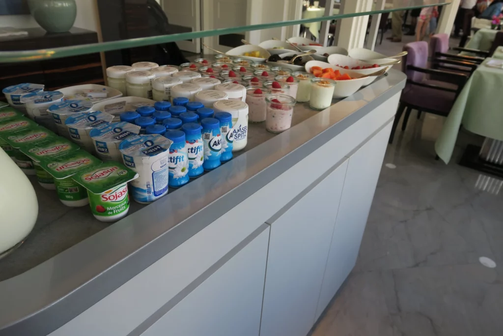 a counter with yogurt and yogurt containers