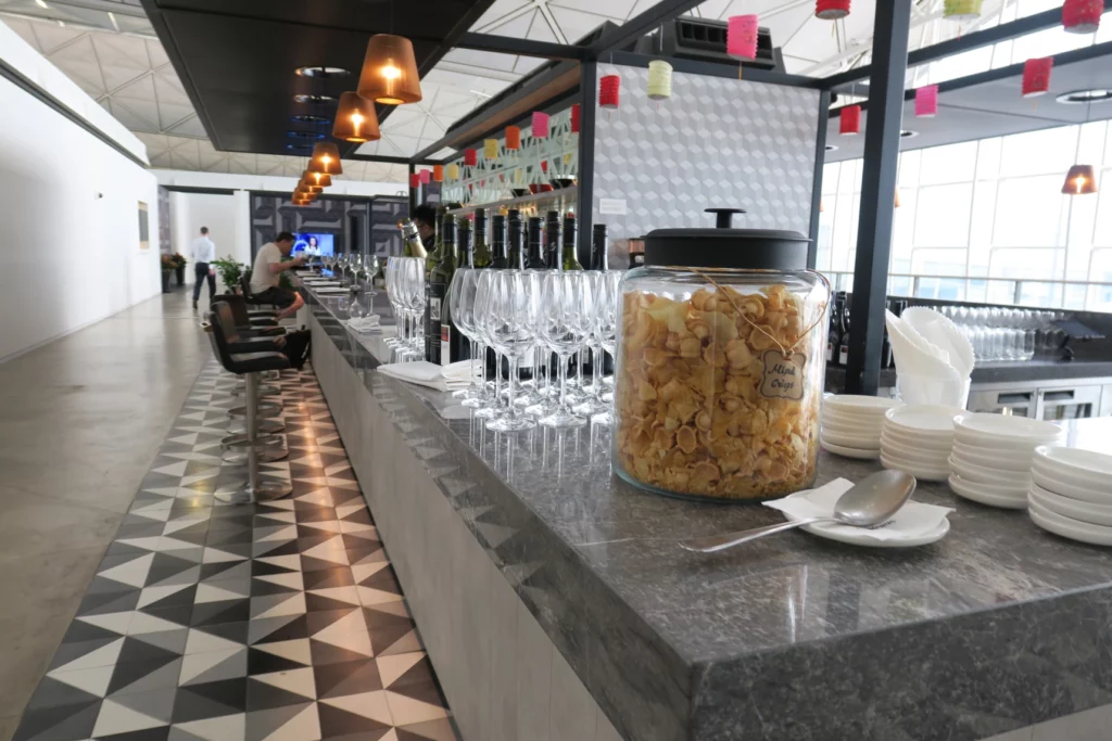 a bar with a variety of glasses and food