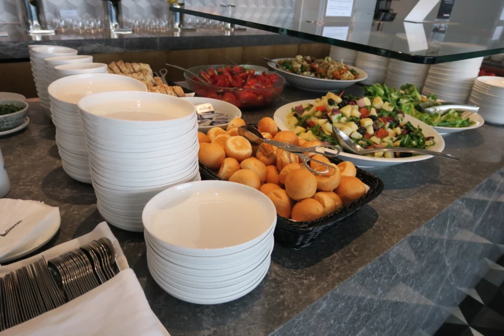 a buffet table with plates and food