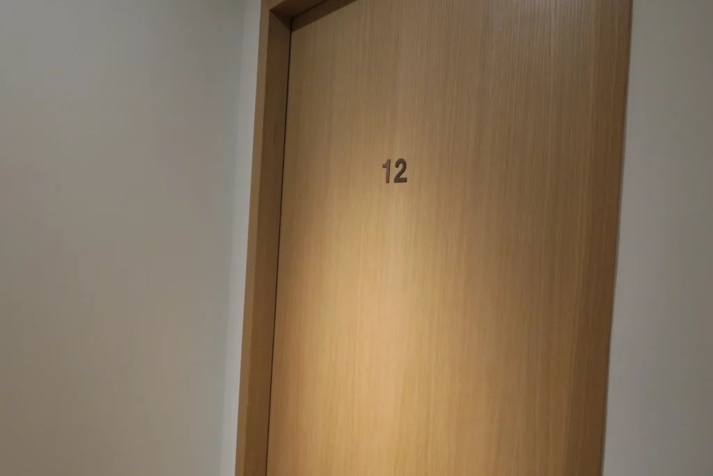 a wooden door with a number on it