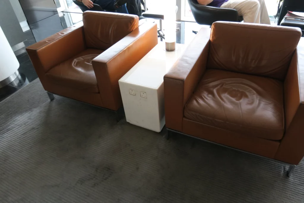 a group of brown leather chairs