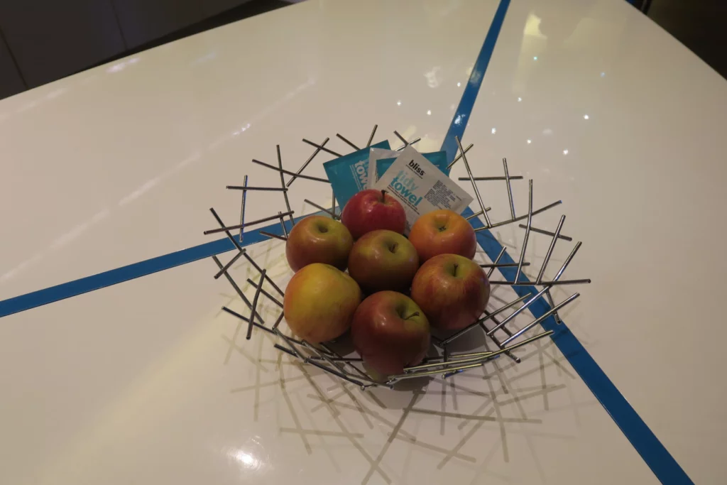 a bowl of apples on a table