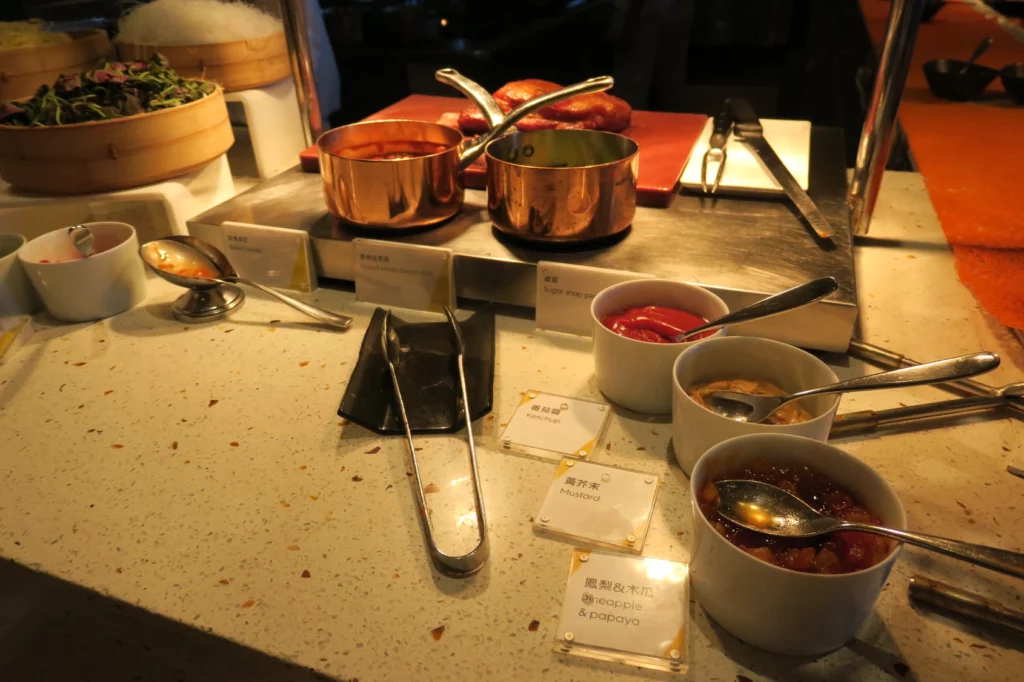 a table with pots and sauces