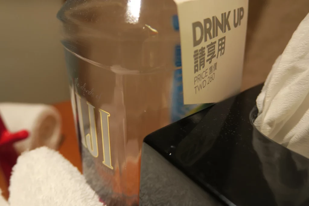 a bottle of water next to a towel