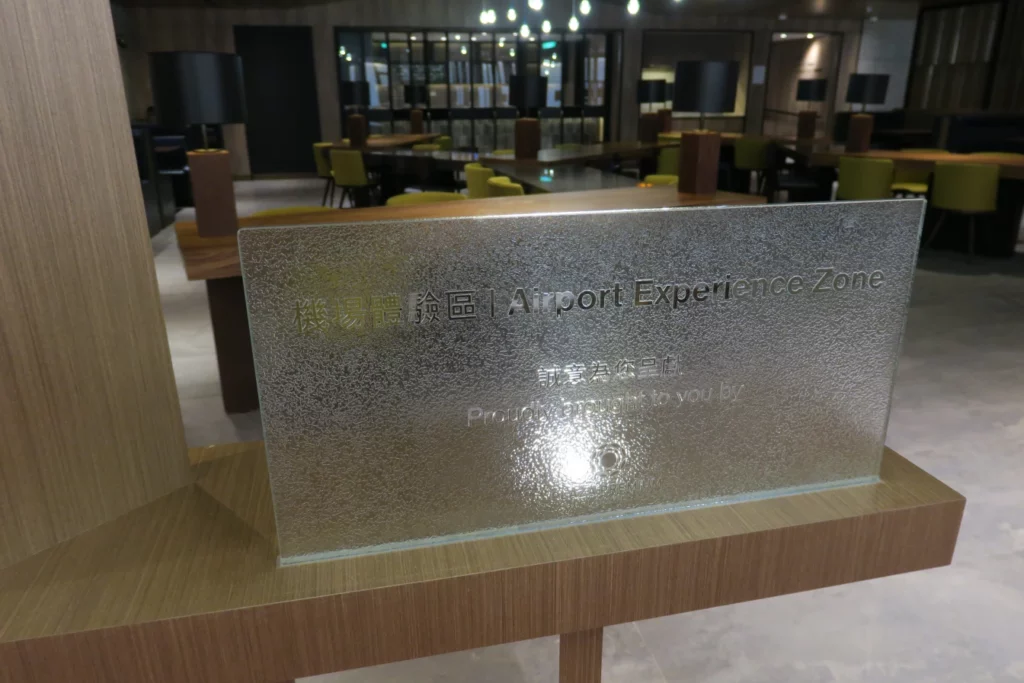 a glass sign on a wooden stand