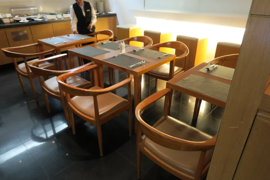 a group of tables and chairs in a restaurant