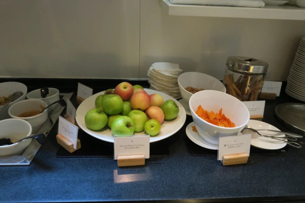 a plate of fruit and cereals on a counter