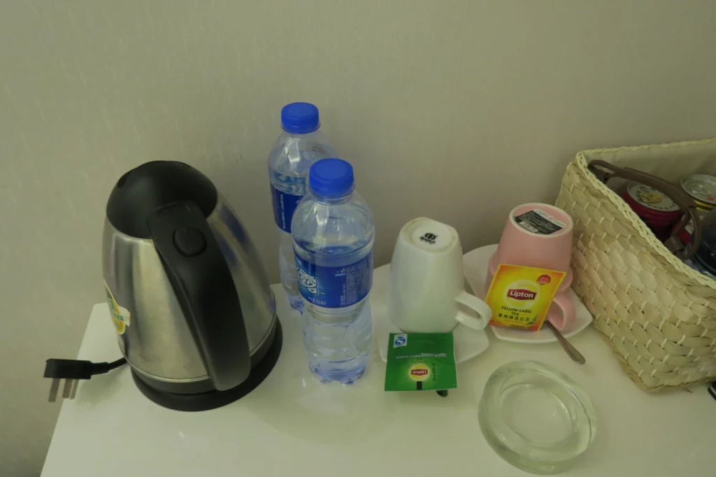 a group of water bottles and cups on a table