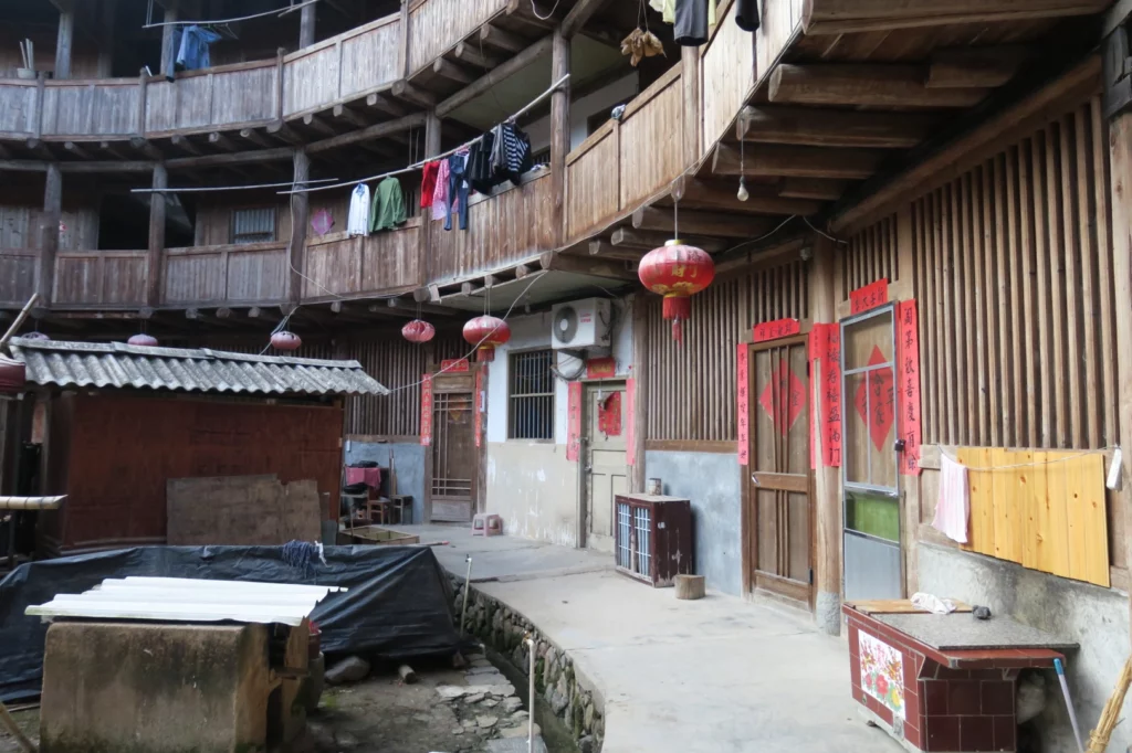 a courtyard with balconies and clothes