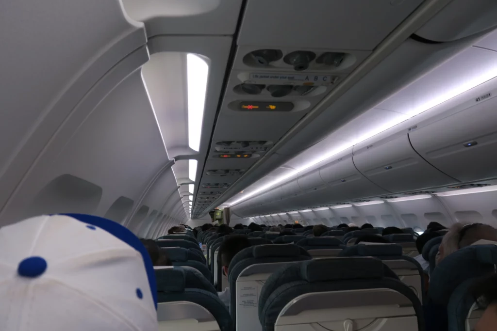 a plane with seats and people in it