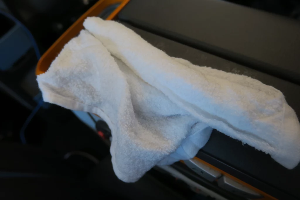 a white towel on a black surface