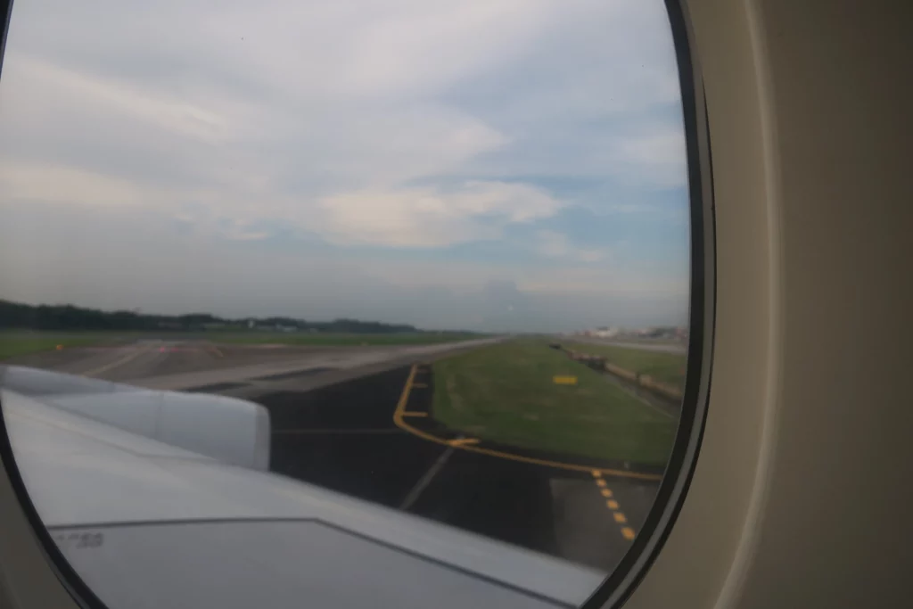 a view of a runway from an airplane window