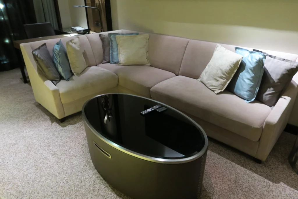 a couch with pillows in a room