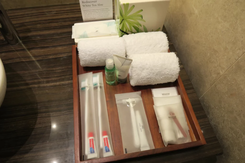 a tray of toiletries and towels