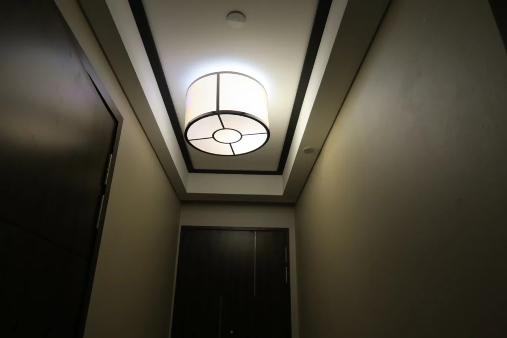 a light fixture in a hallway