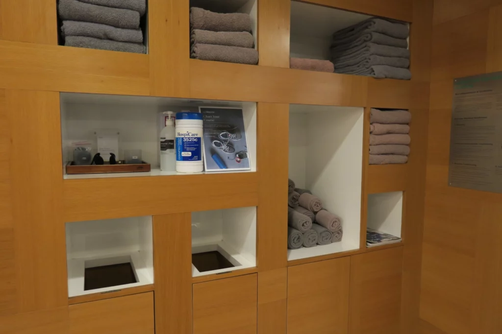 a shelf with towels and other items