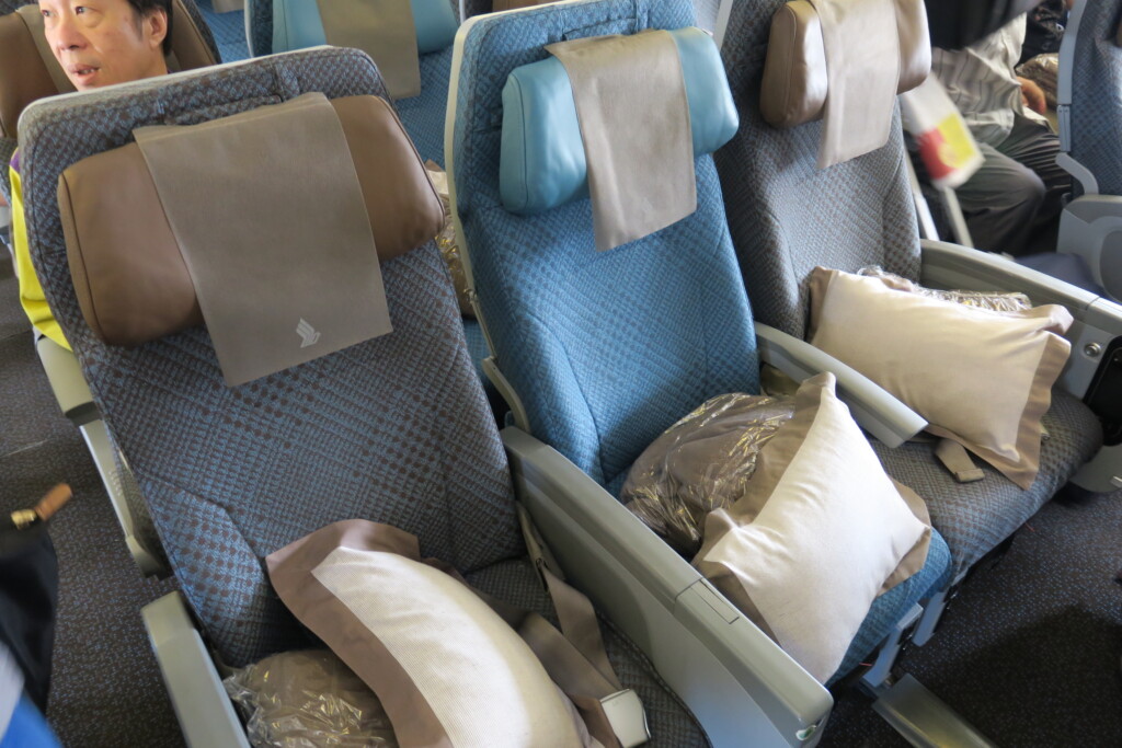 a group of seats with pillows