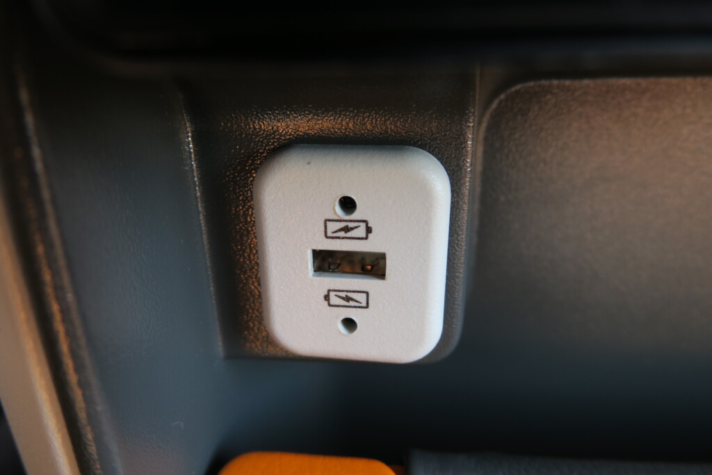 a white and black power outlet with two usb ports