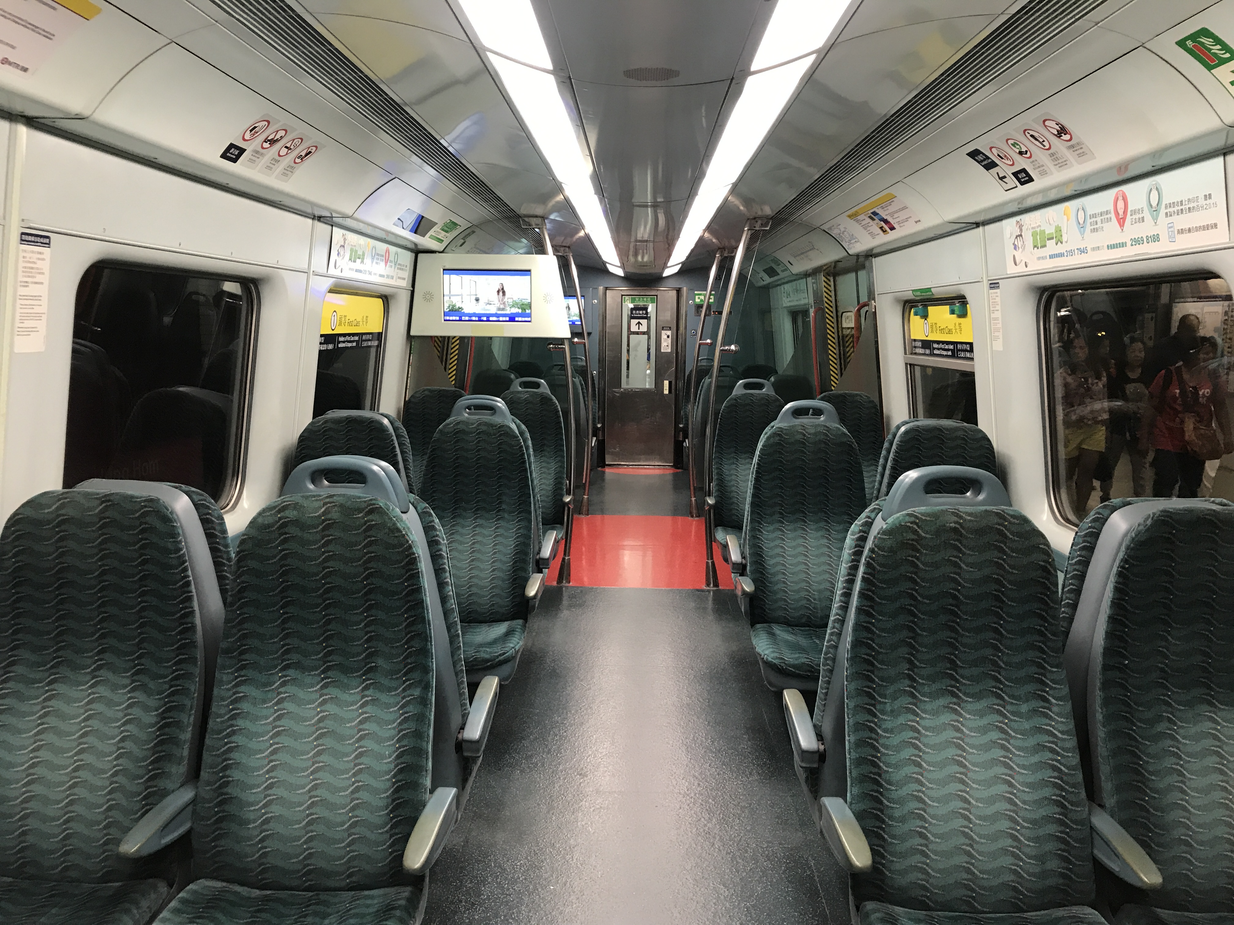 a train with seats and a television