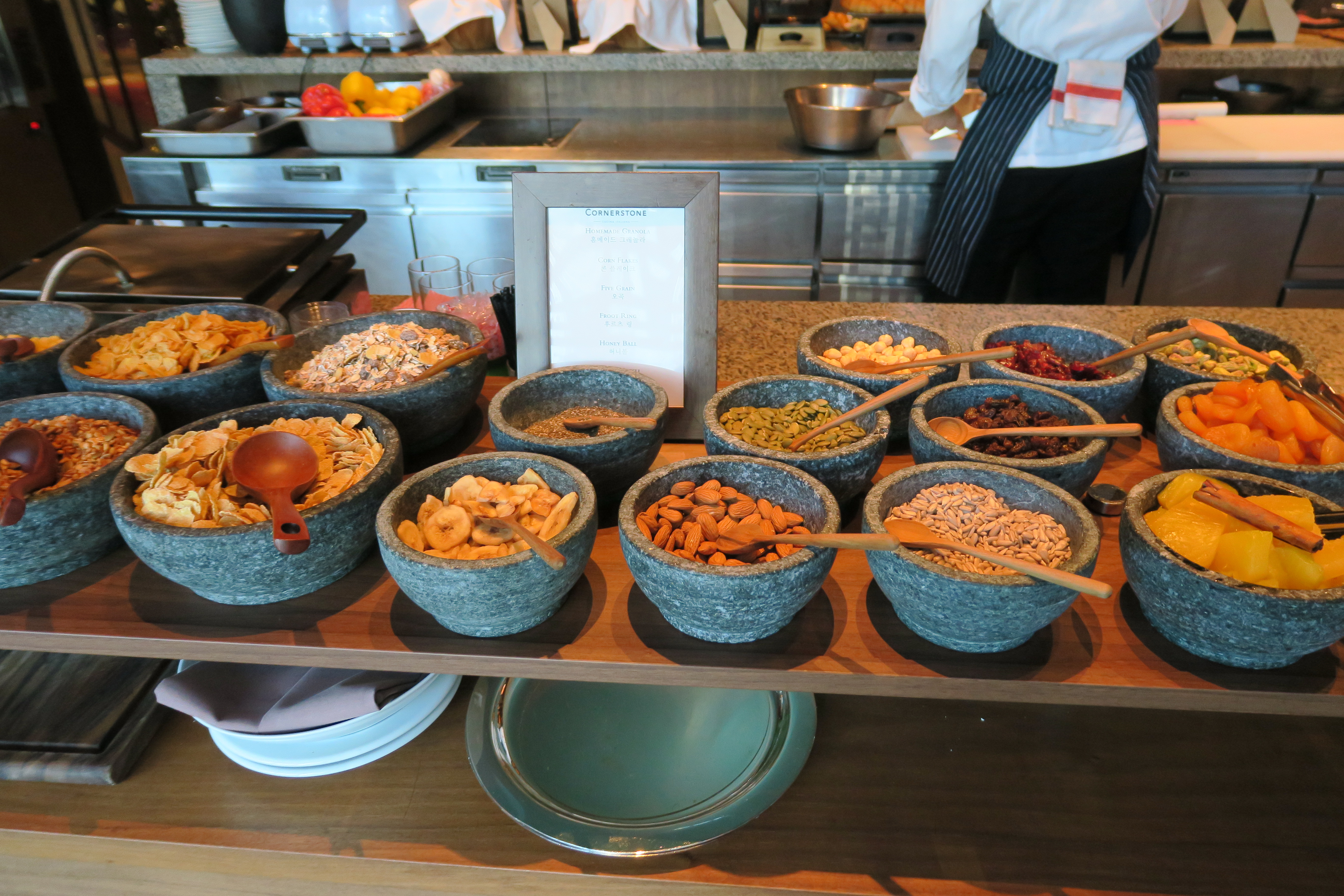 a group of bowls of food on a counter