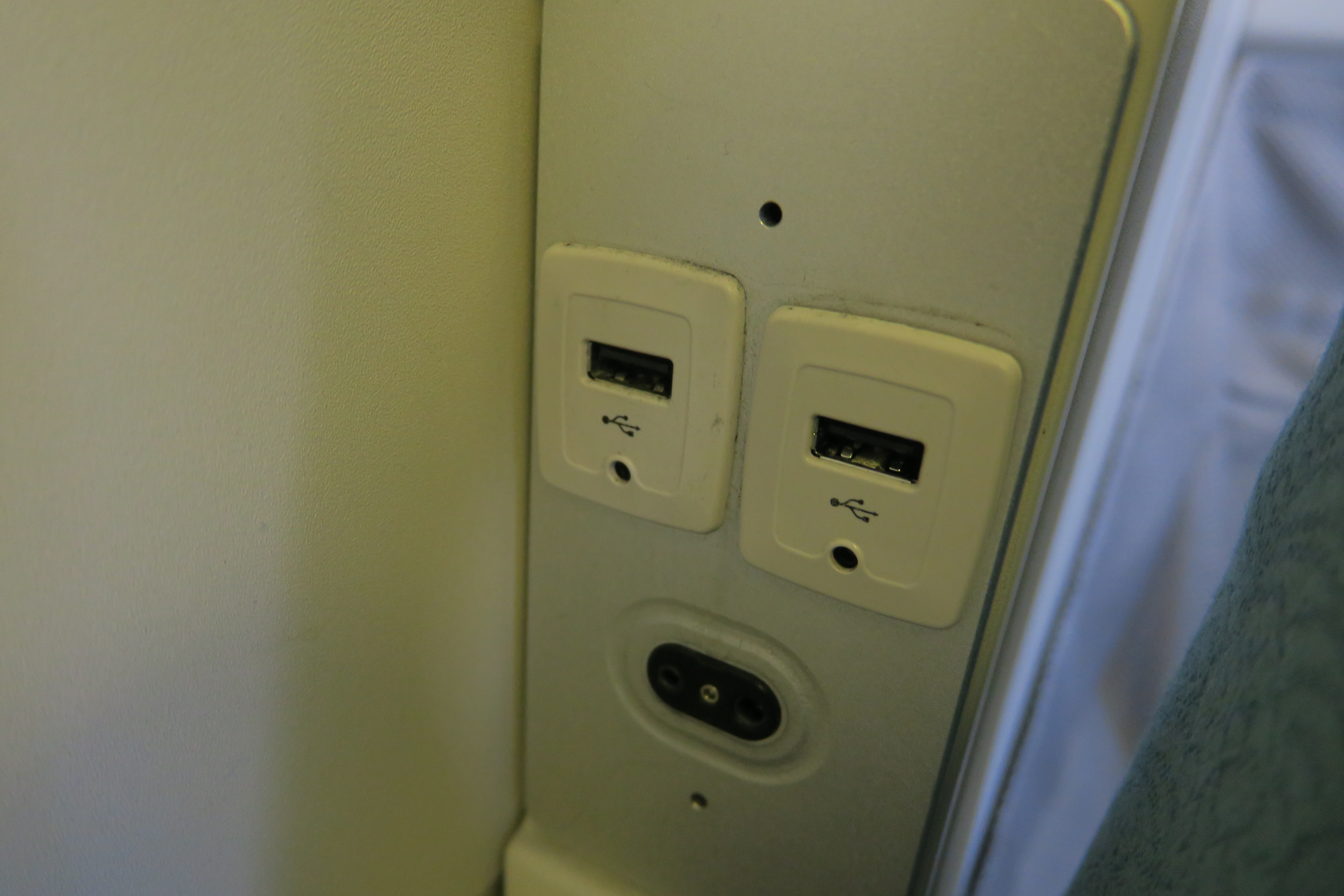 a white rectangular outlet with usb ports