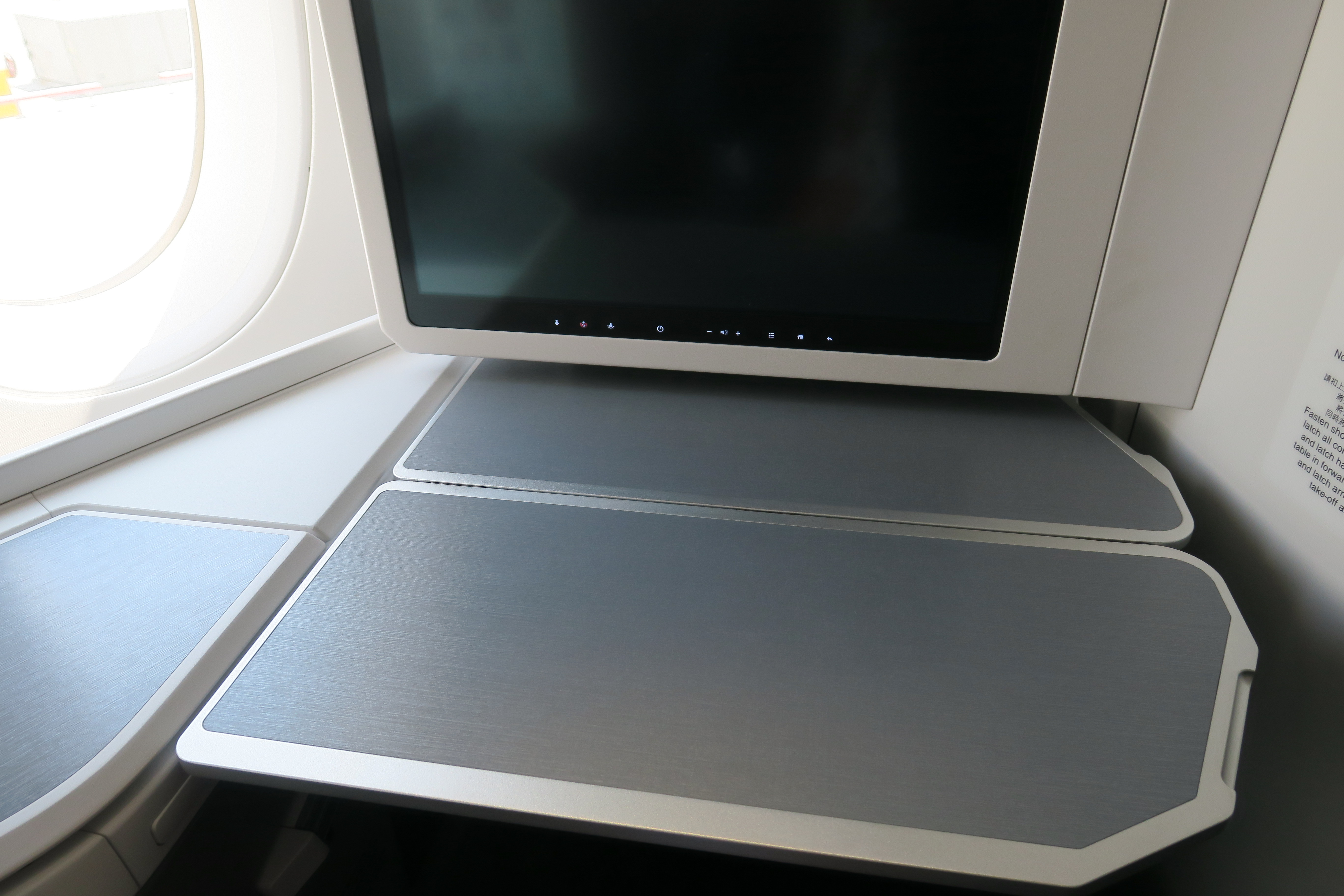 a computer screen on a plane