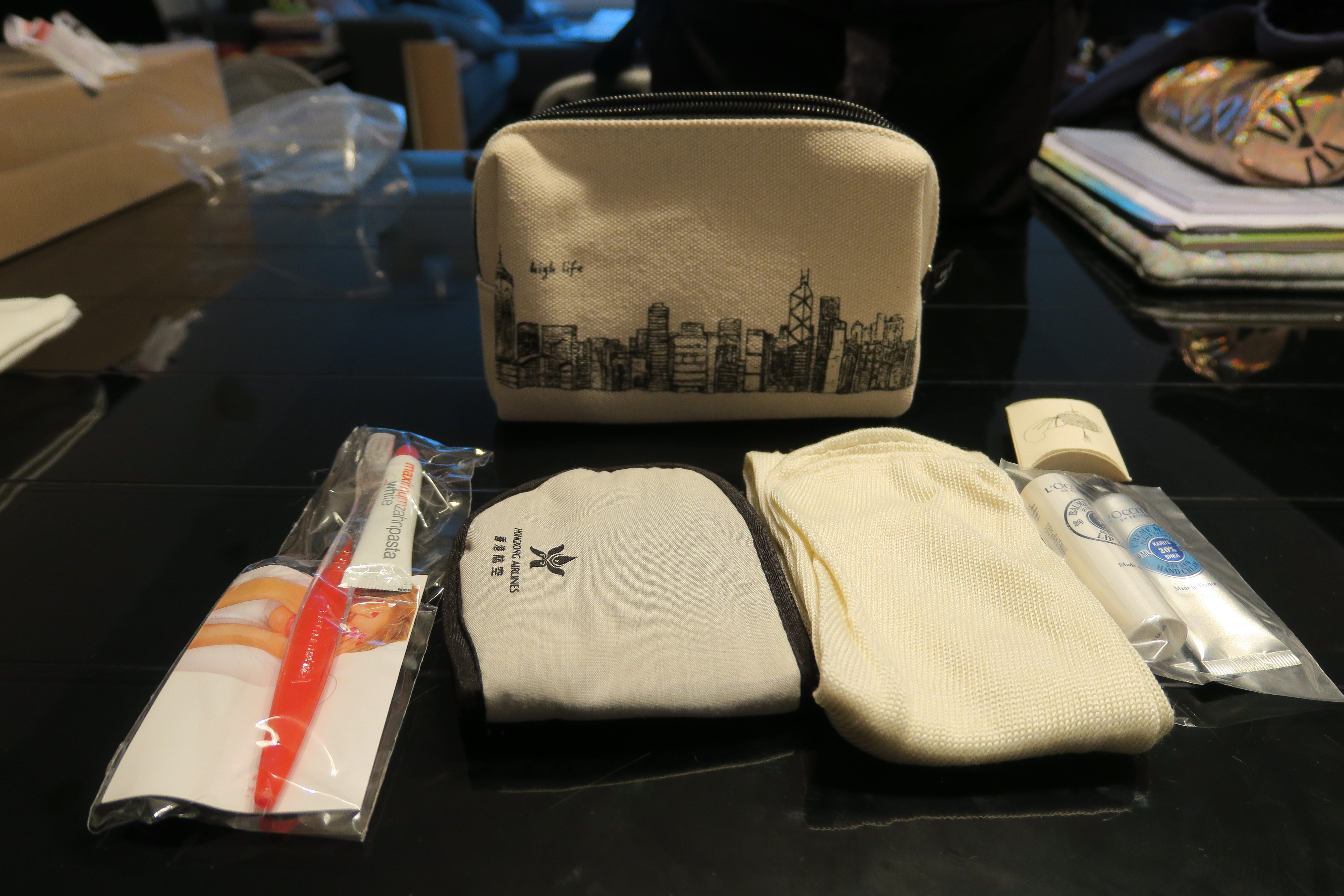 a small white bag with a city design on it