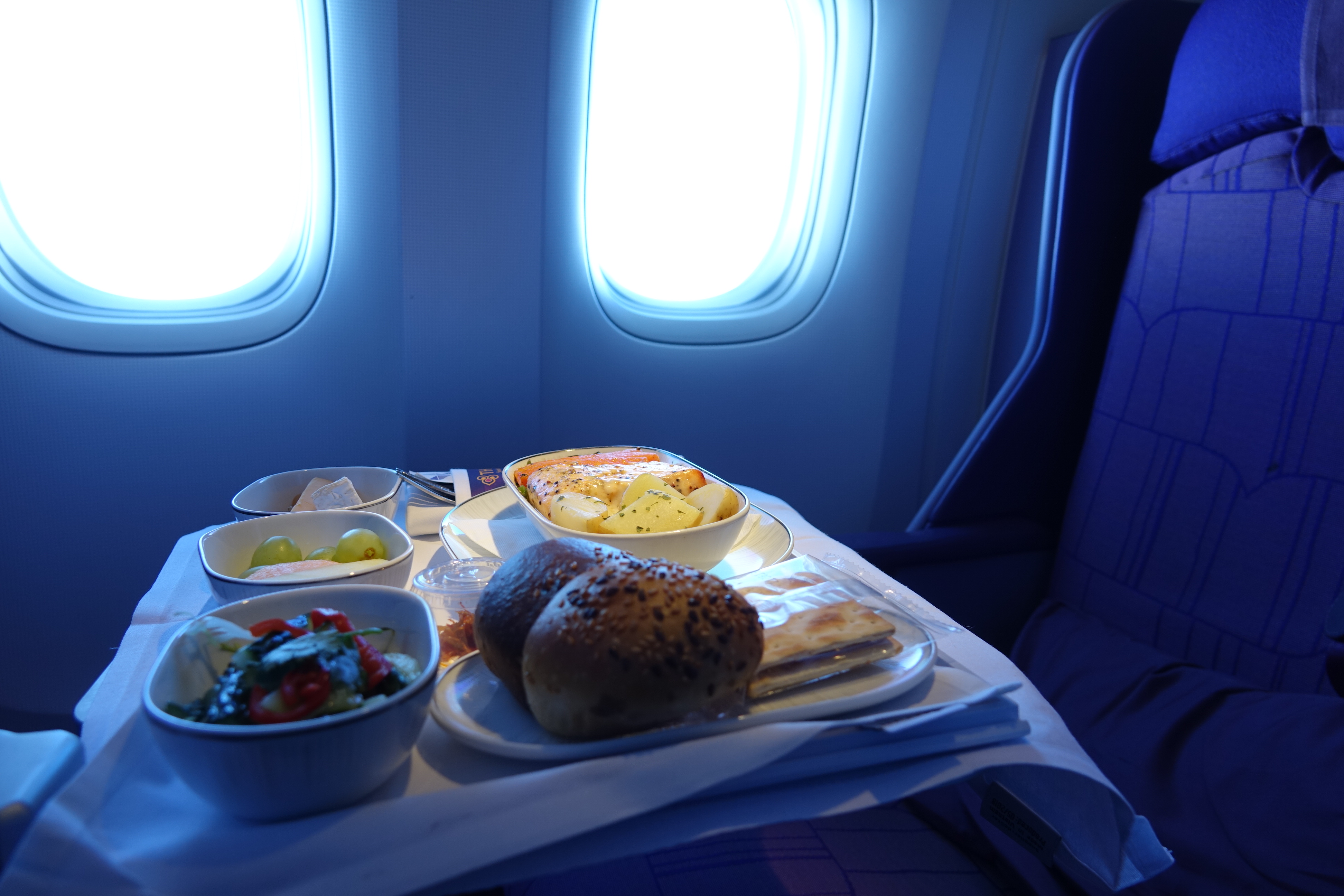 food on a table in an airplane