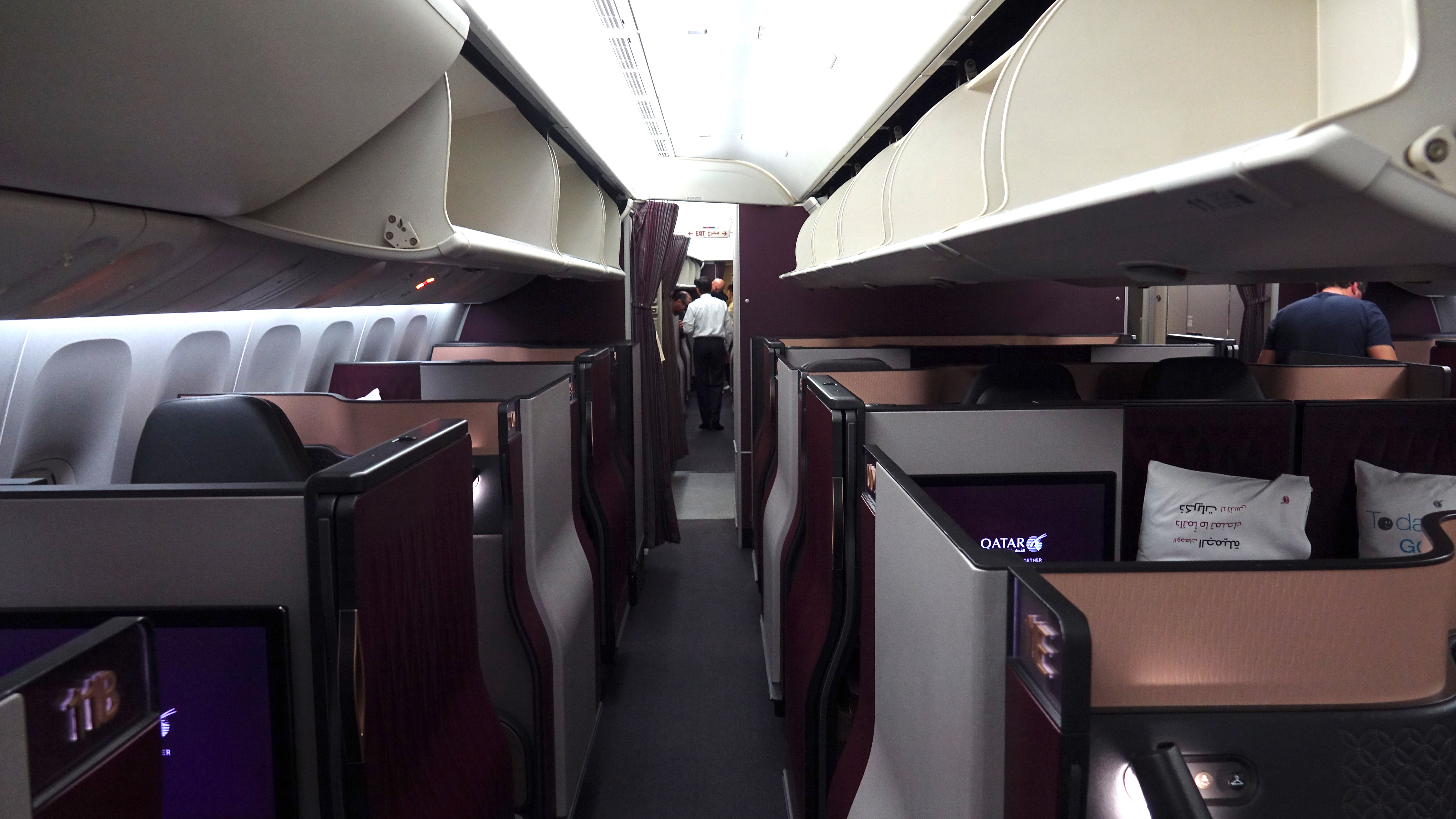 a inside of an airplane with rows of seats