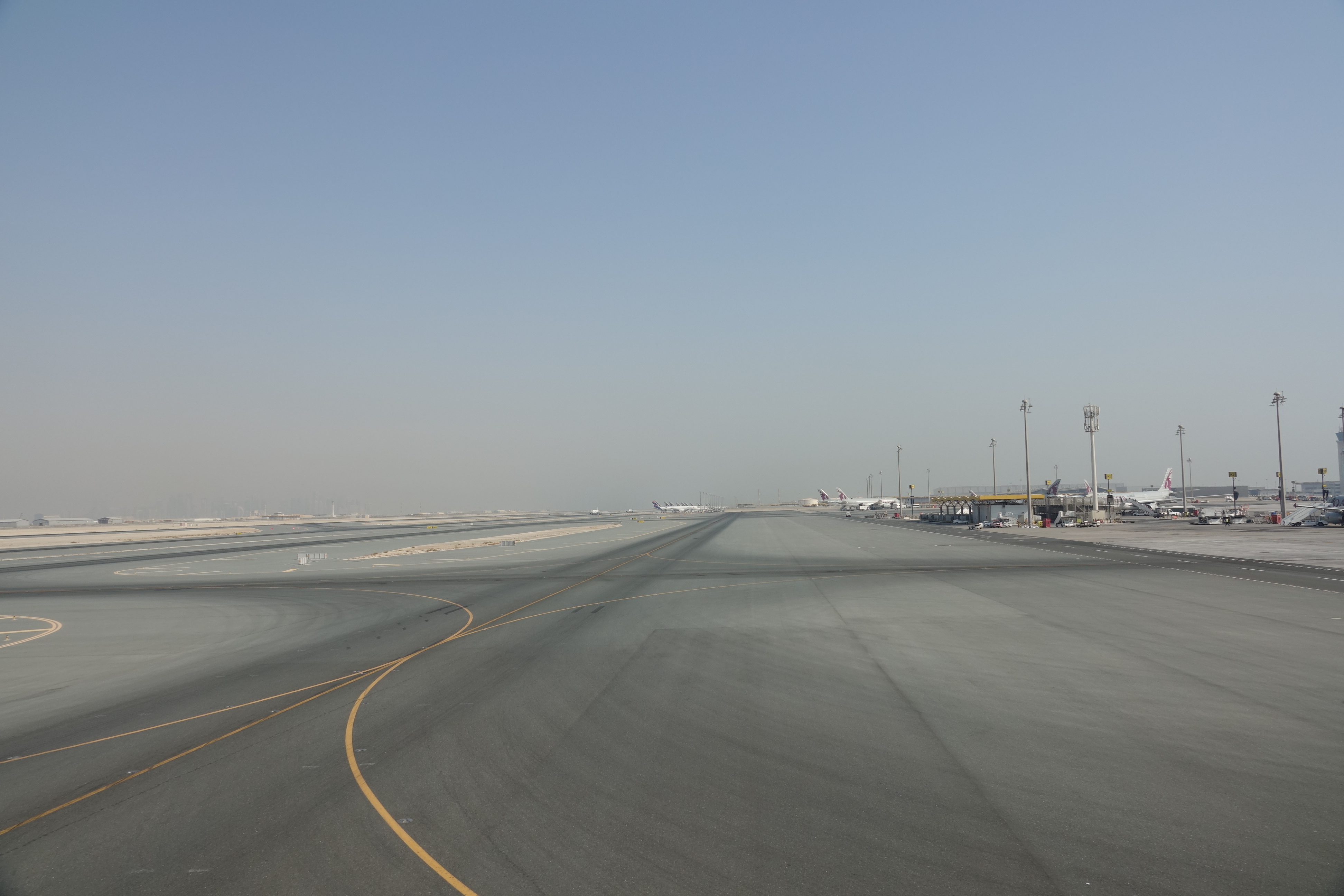an empty runway with an airplane on it