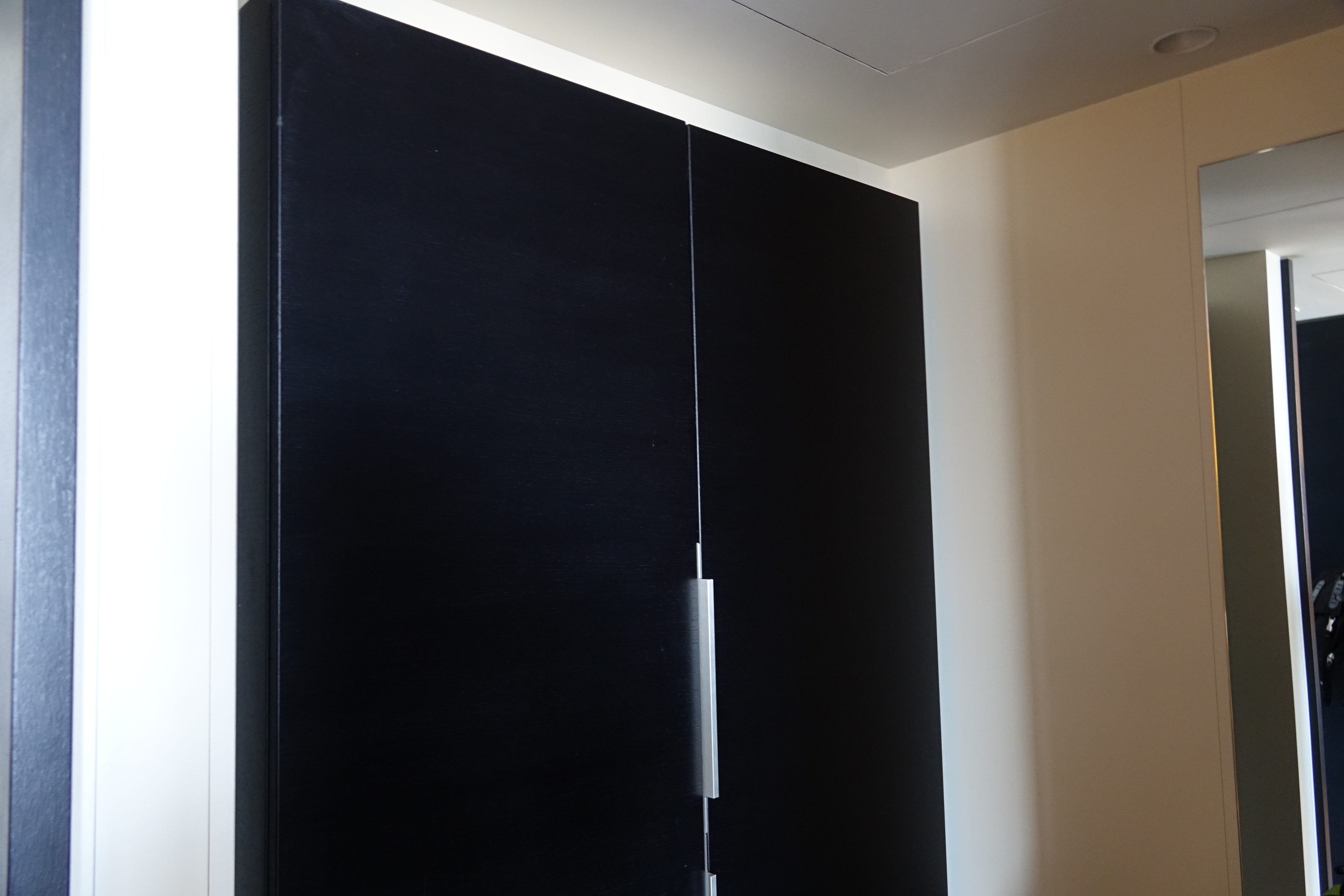 a black cabinet with a silver handle