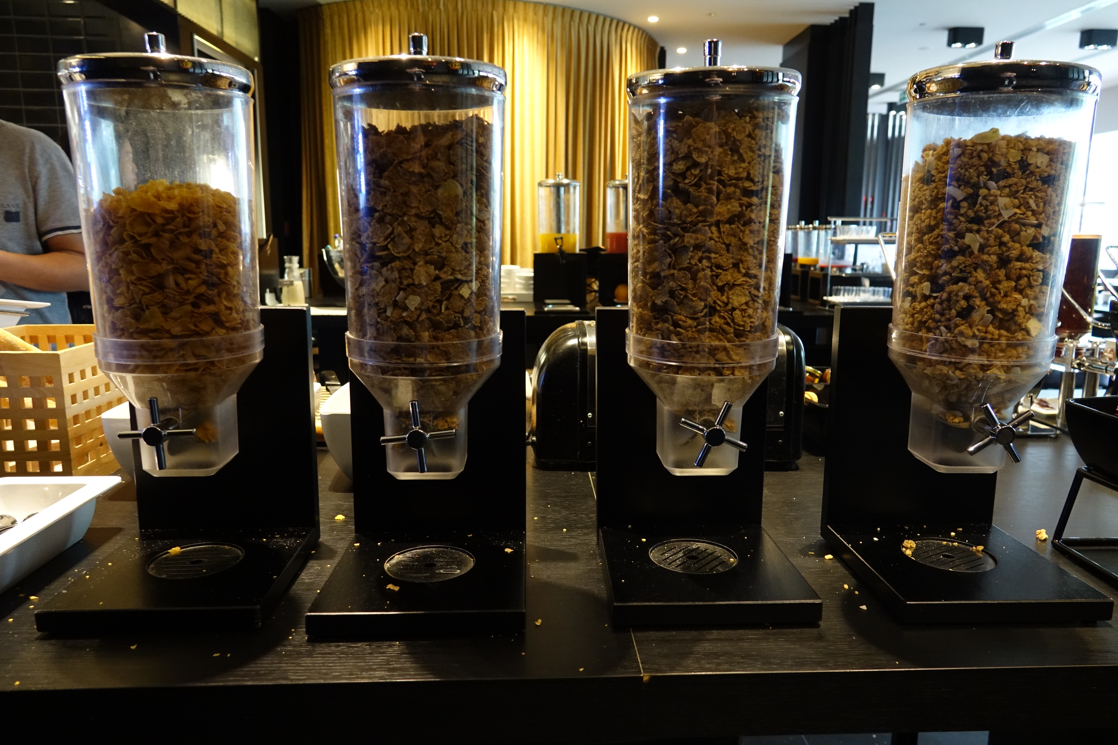 a row of cereal dispensers