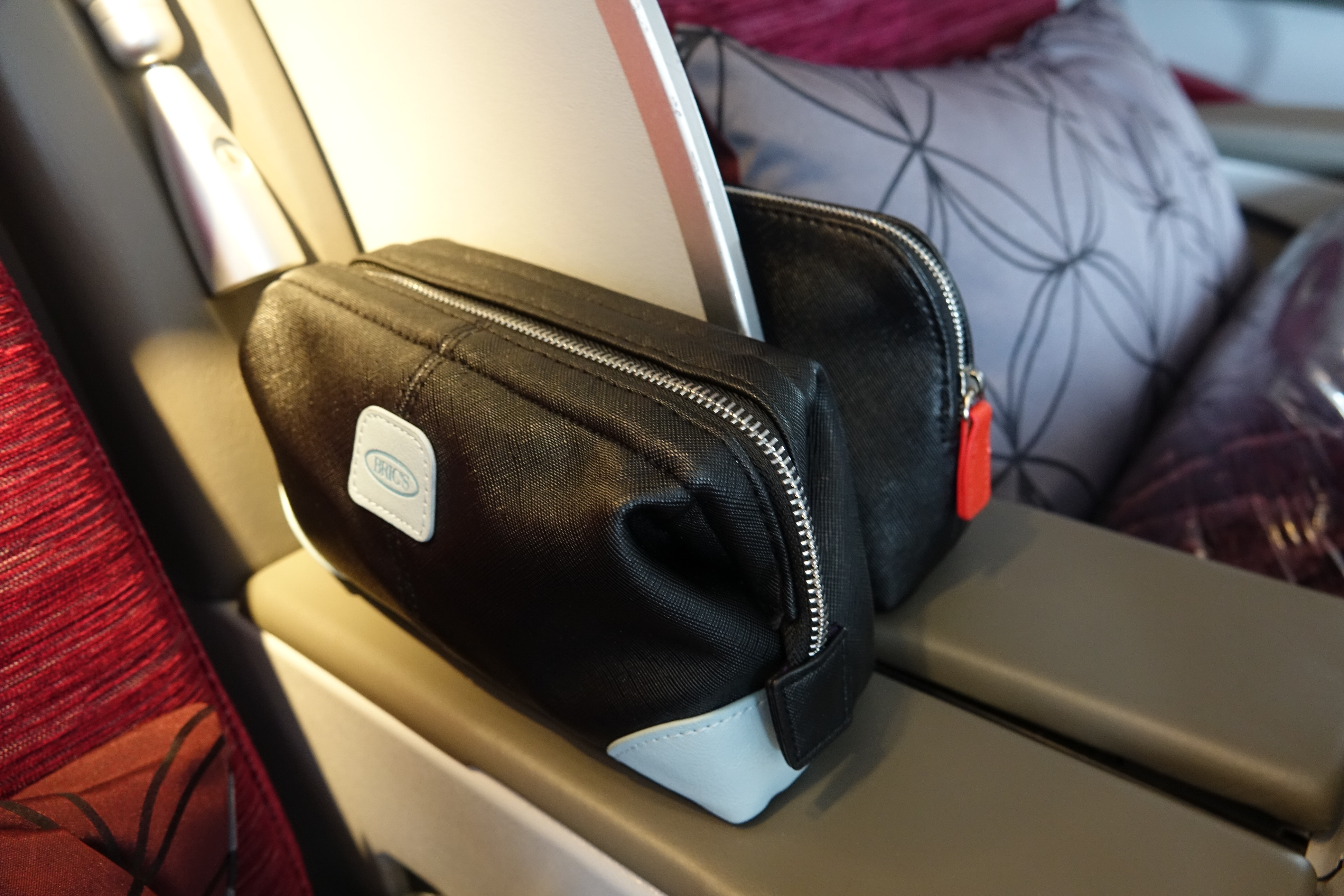 a black and white purses on a seat
