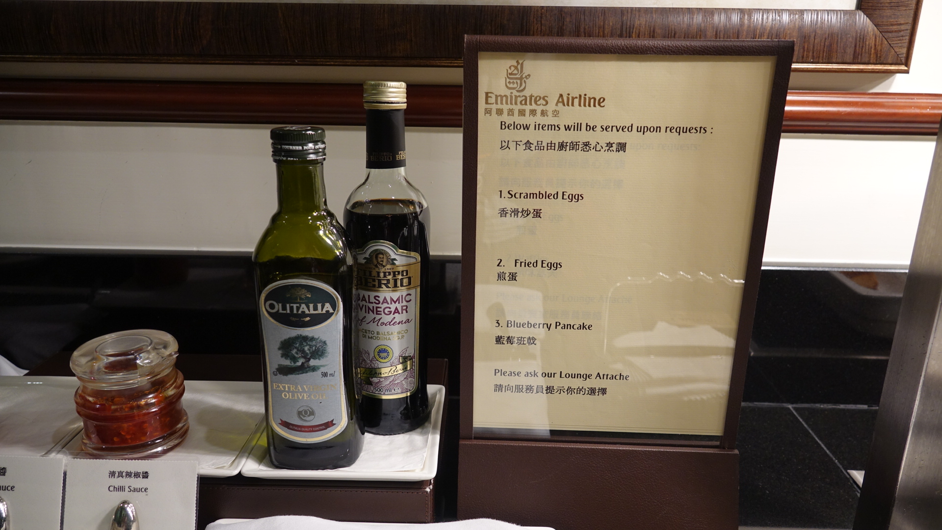 a bottle of oil and a menu