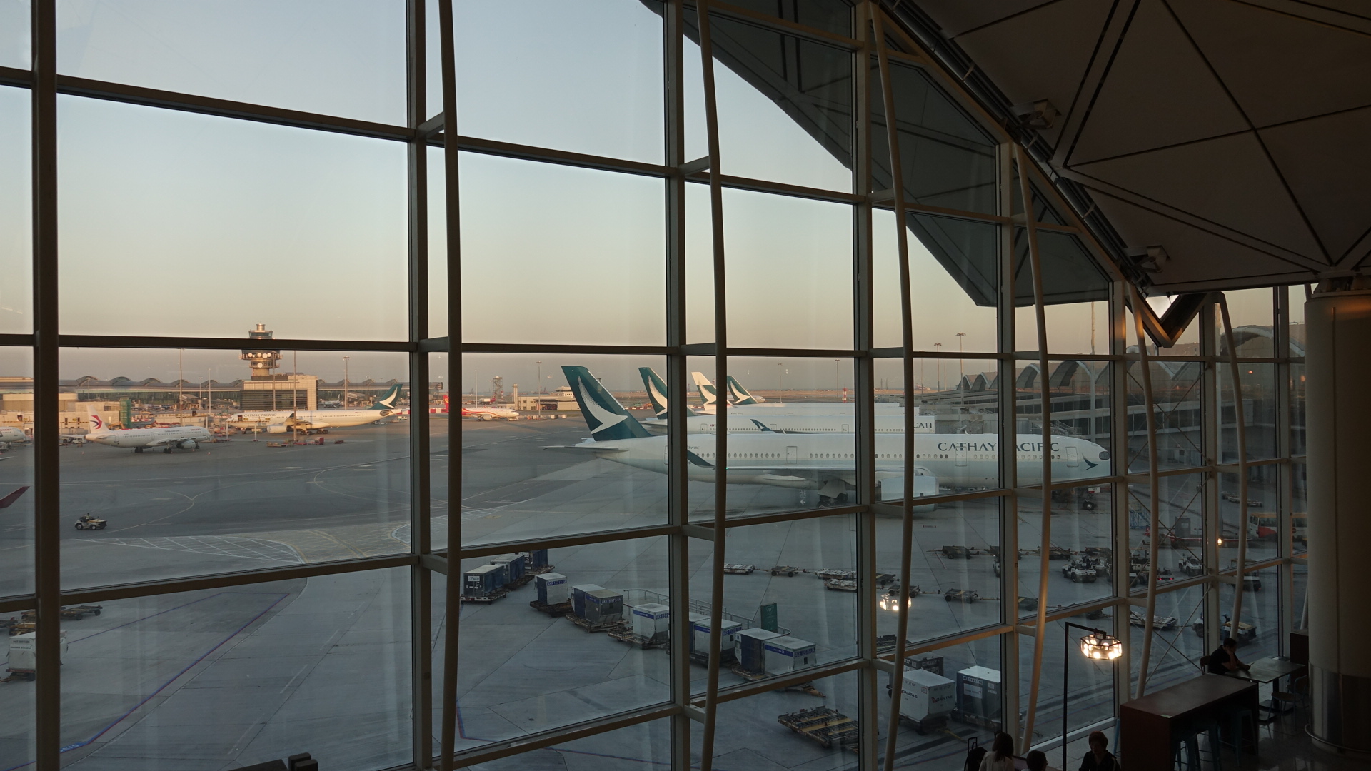 a large window with many windows and airplanes on the ground