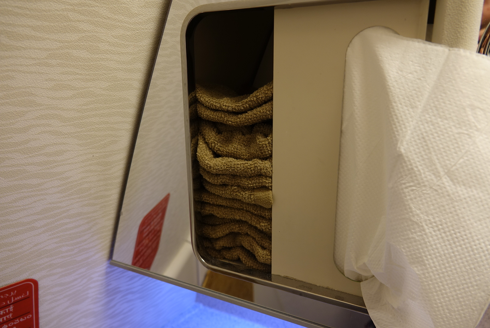 a stack of towels in a shelf