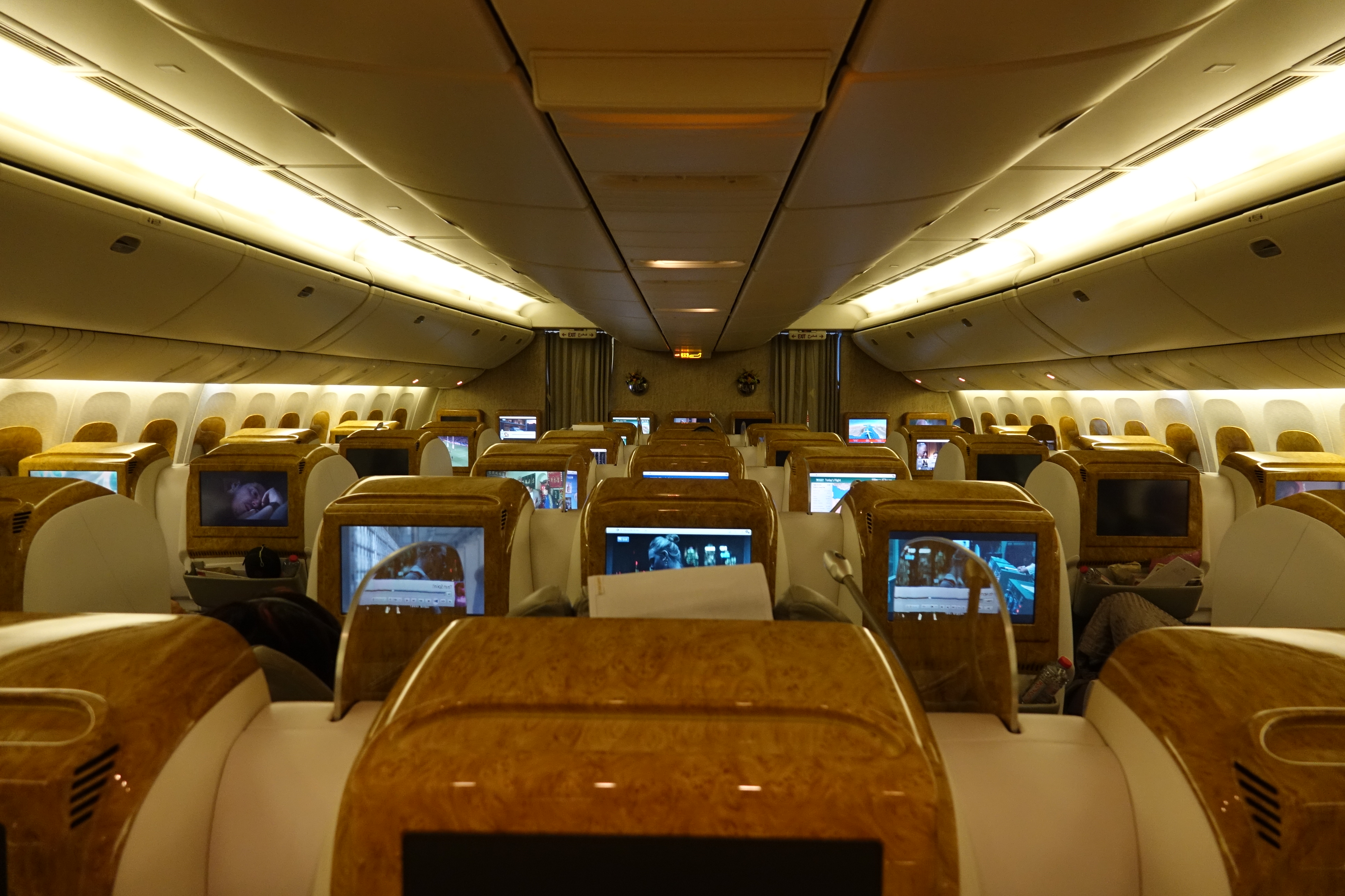 a row of tvs on an airplane