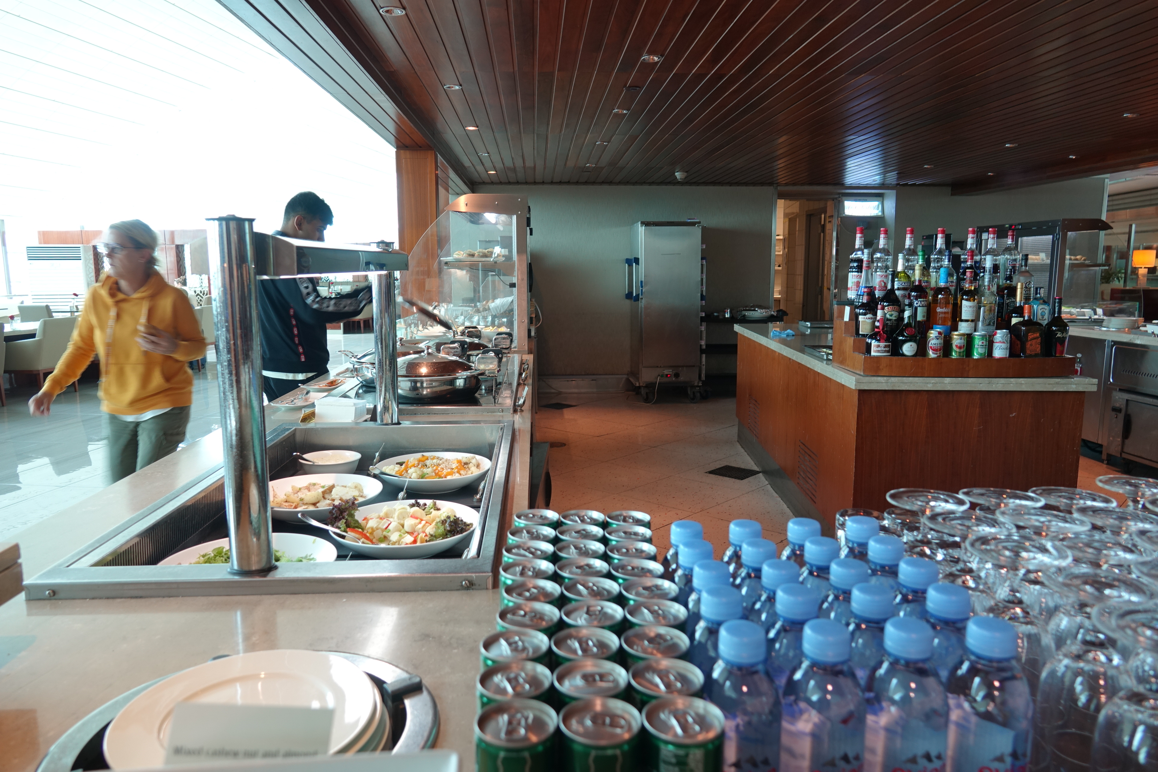 a buffet line with food and drinks
