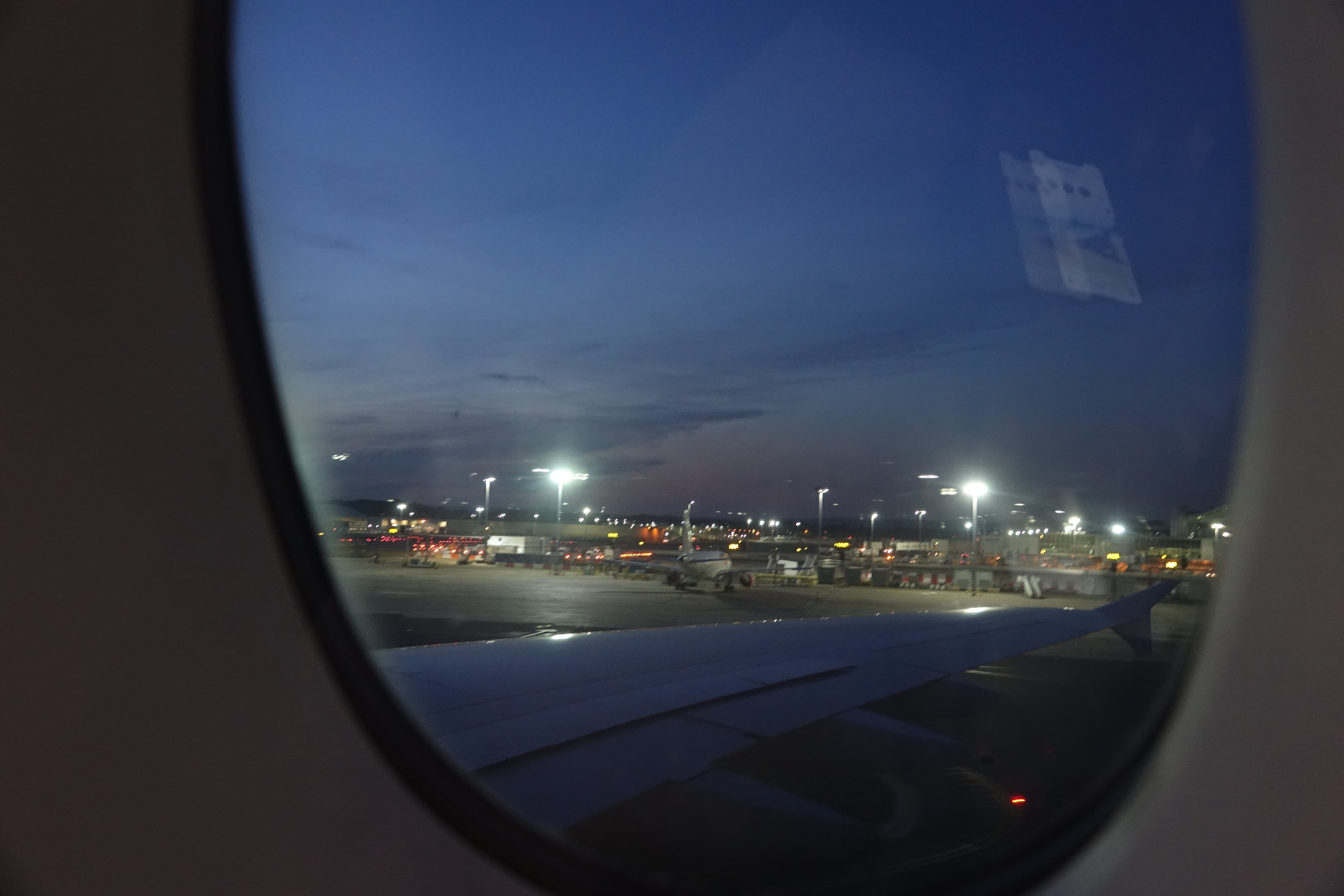 a view of an airplane wing at night